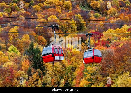 Autumn gondola sightseeing excursion at Stowe Mountain in Vermont. Stock Photo