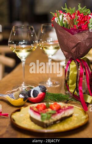 Flowers and toys on the festive table Stock Photo