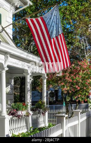 Charming home exterior with American flag. Stock Photo