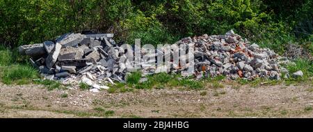 Construction Waste Thrown Away in Nature. Environmental Pollution Concept Stock Photo