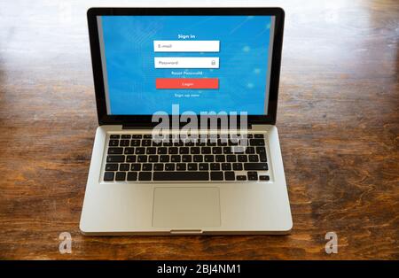 Password login on computer screen, Unlock laptop, cyber lock internet security concept. Business home office wood desk background. Stock Photo