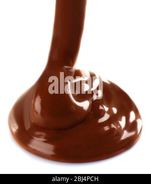 Melted milky brown chocolate pouring, isolated on white Stock Photo