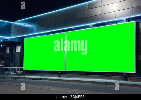 Blank citylight for advertising on the building at city, copyspace for your text, image, design. Media marketing, ads, promo announcement, commercial propose or message. Banner, template chromakey. Stock Photo