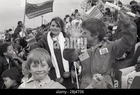 1984, 8th May, historical, excited youngsters outside waving flags waiting for the appearance of Her Majesty the Queen to Greenwich for the Official opening of the Thames Barrier, Charlton riverside, Greenwich, London, England, UK. Stock Photo