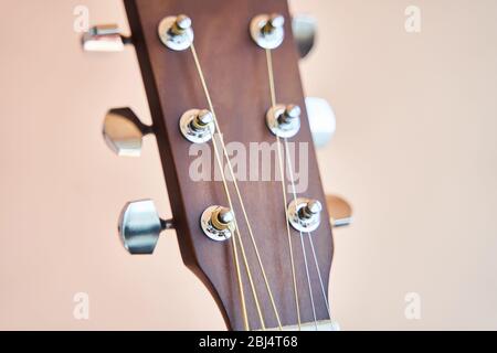 Acoustic guitar headboard with pegs. Guitar fretboard.  Stock Photo
