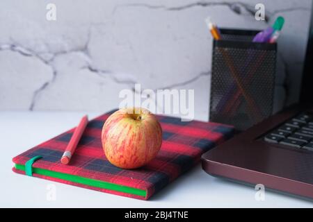 notebook with pencil and apple on table  Stock Photo