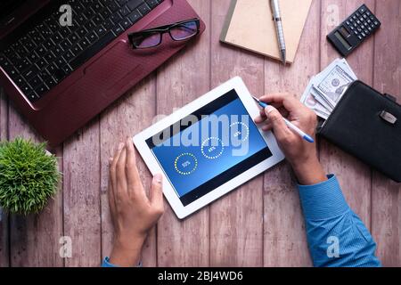 person hand analyzing financial data on digital tablet  Stock Photo