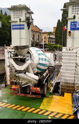 CADENABBIA, LAKE COMO - JUNE 2019: Large concrete mixer truck driving off a ferry at Cadenabbia on Lake Como. Stock Photo