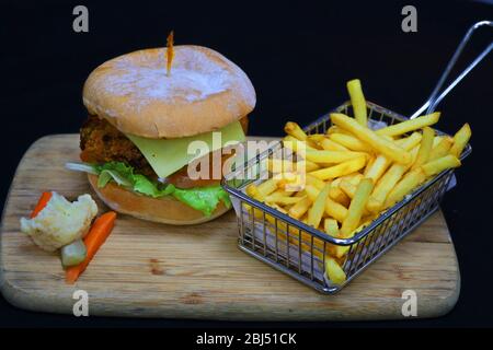 vegetable burger with french fries in a wood board Stock Photo