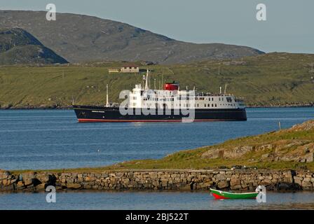 HEBRIDEAN PRINCESS departing her overnight anchorage in the morning sunlight, SOUND OF VATERSAY, OUTER HEBRIDES, SCOTLAND Stock Photo