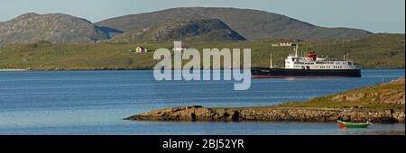 HEBRIDEAN PRINCESS departing her overnight anchorage in the morning sunlight, SOUND OF VATERSAY, OUTER HEBRIDES, SCOTLAND Stock Photo