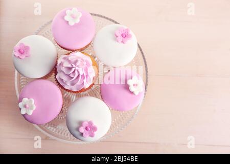 Tasty cupcake on stand, close-up Stock Photo
