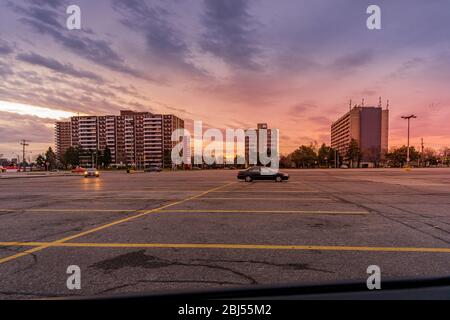 Empty parking lot with panoramic cityscape in the background at sunset, Toronto, Canada Stock Photo