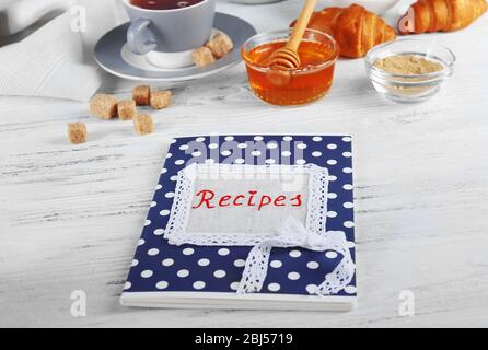 Recipe book on a table with ingredients for baking Stock Photo