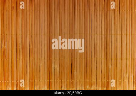 Traditional yellow bamboo pad isolated on white background. Stock Photo