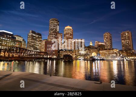 Downtown city view of Boston Massachusetts looking of the riverfront harbor at night Stock Photo