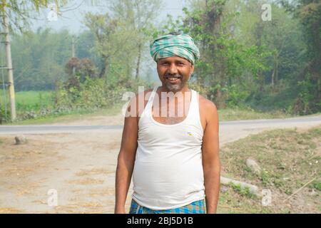 portrait of happy Indian farmer man in rural India concept. white ...