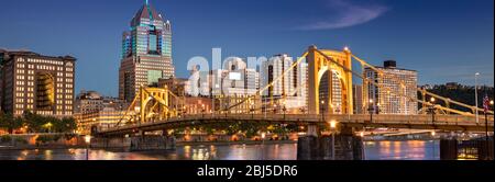 City skyline view over the Allegheny River and Roberto Clemente Bridge in downtown Pittsburgh Pennsylvania USA Stock Photo