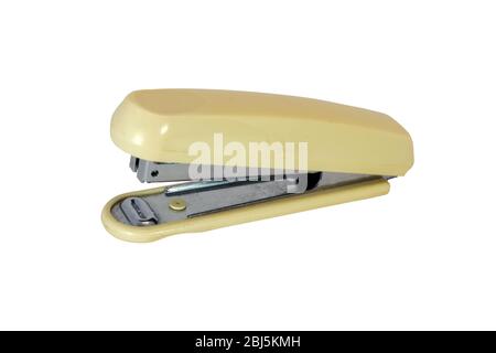Clerical stapler close-up on a white background. side view. Stock Photo