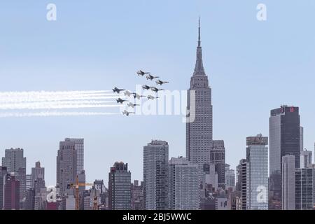 NYC Salute To  Heros - US Navy Blue Angels and the US Air Force Thunderbirds fly by over New York City saluting the frontline first responders. Stock Photo