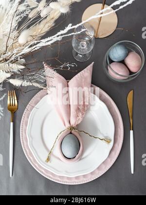 Setting easter table with colored eggs Stock Photo