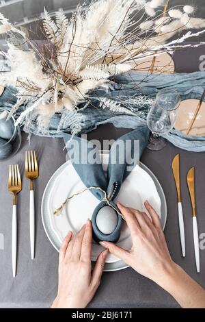 Setting easter table with colored eggs Stock Photo