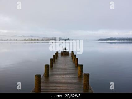 pier at still lake in the British Lake District Stock Photo