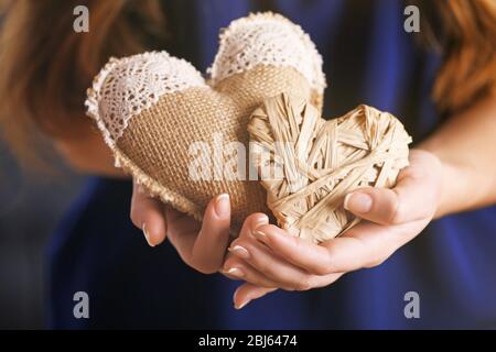 Closeup of craft hearts in female hands Stock Photo