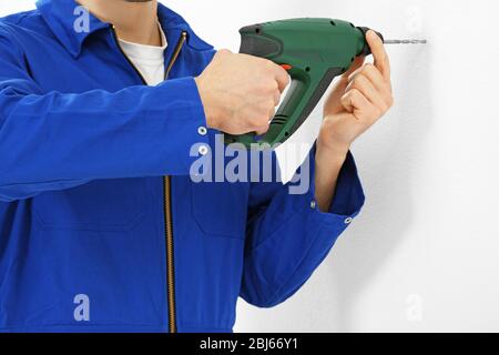 Worker renewing apartment closeup Stock Photo