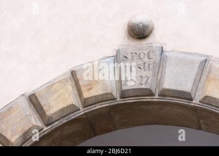 Bas-relief on one of the walls of Cracow. Arched stone over the door of the Cracow Palace Stock Photo