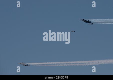 NEW YORK, NY - APRIL 28, 2020: The U.S. Navy's Blue Angels and U.S. Air Force's Thunderbirds jets perform a flyover New York City. Stock Photo