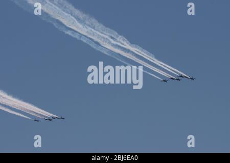 NEW YORK, NY - APRIL 28, 2020: The U.S. Navy's Blue Angels and U.S. Air Force's Thunderbirds jets perform a flyover New York City. Stock Photo