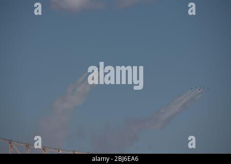 NEW YORK, NY - APRIL 28, 2020: The U.S. Navy's Blue Angels and U.S. Air Force's Thunderbirds jets perform a flyover New York City. Stock Photo