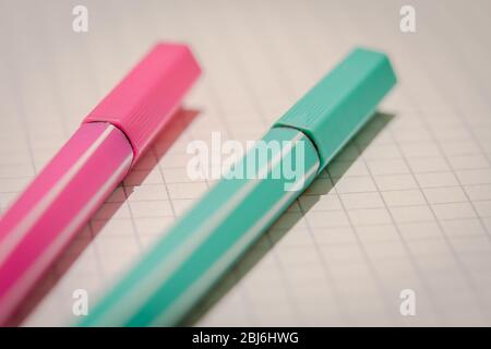 two highlighters on school graph paper Stock Photo