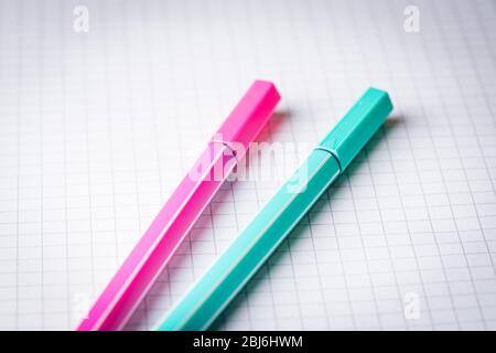 two highlighters on school graph paper Stock Photo