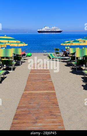 Beach umbrellas, Giardini Naxos City, Sicily Island, Italy, Europe Stock Photo