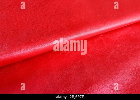 Red shiny leather texture close up Stock Photo