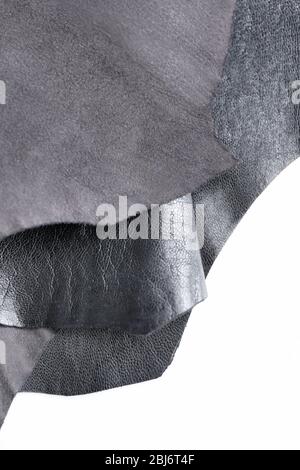 Black leather front and wrong side texture on white background, close-up Stock Photo