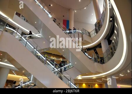 Escaletors and shoppers at DiverCity shopping mall in Tokyo Plaza, obaide, Tokyo, Japan Stock Photo