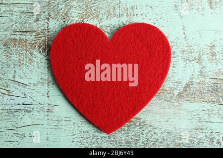 Red felt hearts on blue wooden background Stock Photo
