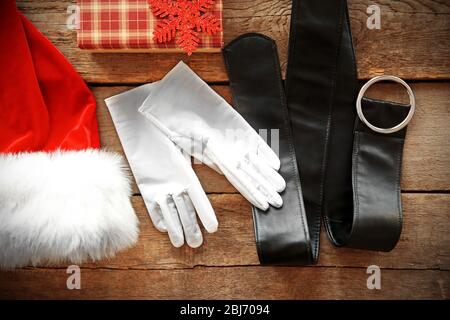 Santa Claus costume on wooden background, close up Stock Photo