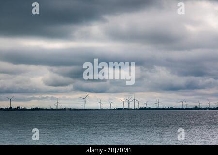 Wind turbines for producing eolian energy on Wolfe Island seen from St Lawrence river, Ontario, Canada Stock Photo