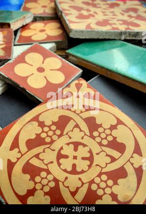 Variety of types and sizes of  Victorian floor ceramic tiles including some manufactured by Minton and co, stoke on trent, Stock Photo