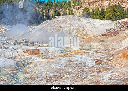 Steam and Sulfur Coated Rocks in a Hydrothermal Area in Lassen Volcanic National Park in California Stock Photo
