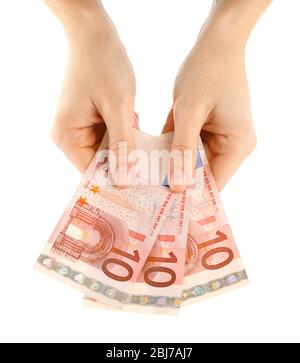 Fan of money in female hands isolated on white Stock Photo