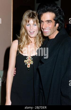 LOS ANGELES, CA. c.1994: Actress/model Claudia Schiffer & boyfriend magician David Copperfield.  File photo © Paul Smith/Featureflash Stock Photo