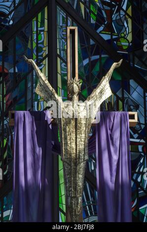 Close up statue of Jesus Christ draped with purple cloth during Easter time religious celebrations Stock Photo