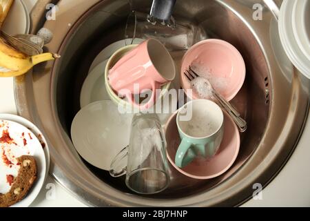Dirty dishes in kitchen sink closeup Stock Photo