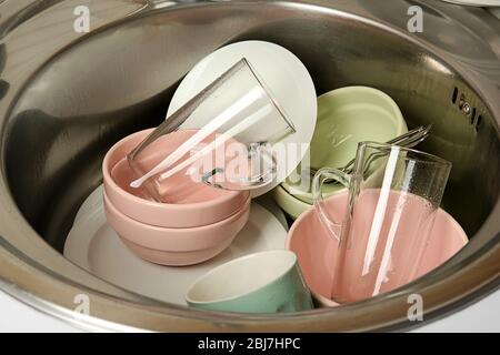 Dirty dishes in kitchen sink closeup Stock Photo