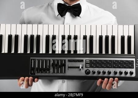 Male hands with synthesizer closeup Stock Photo